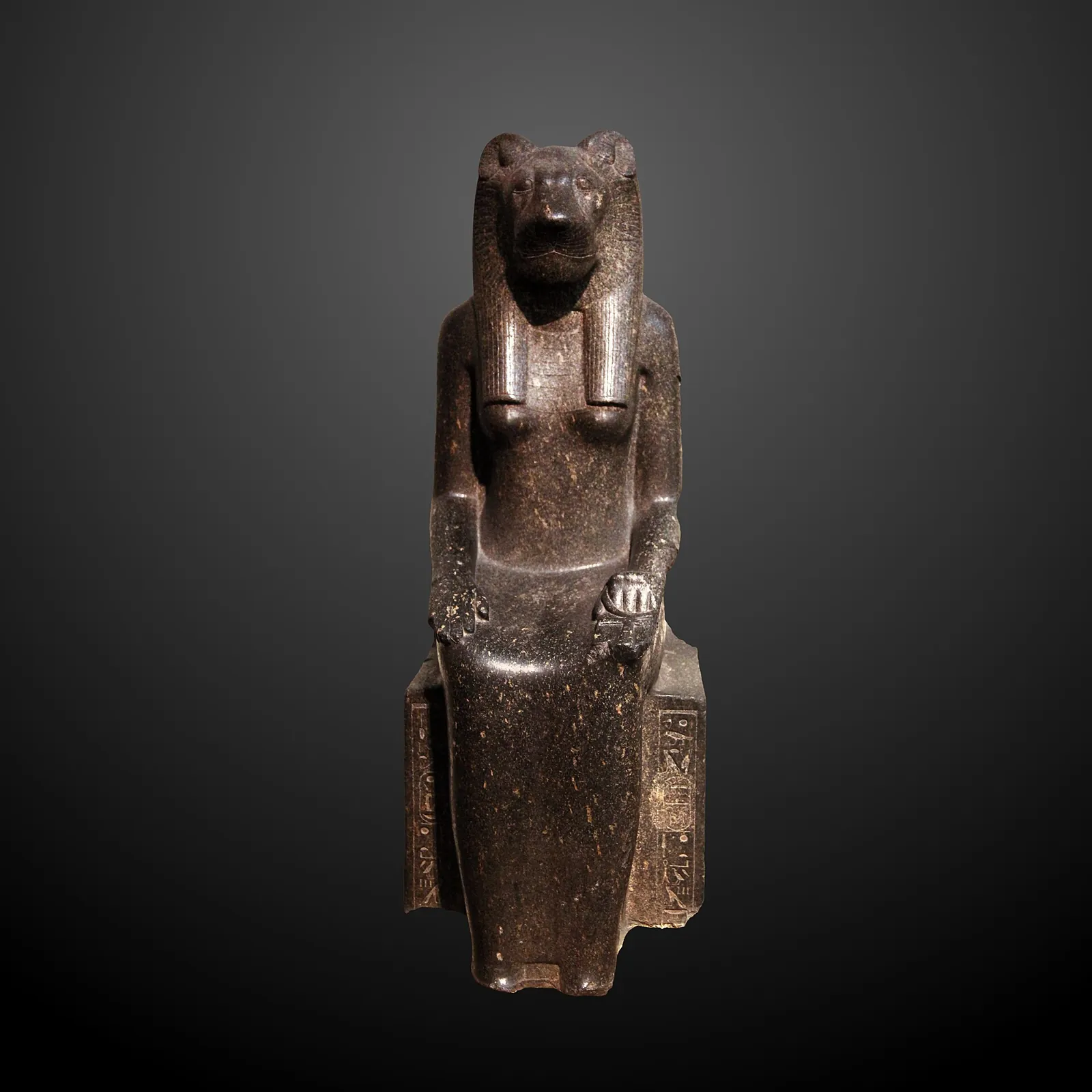 A seated stone statue of the goddess Sekhmet